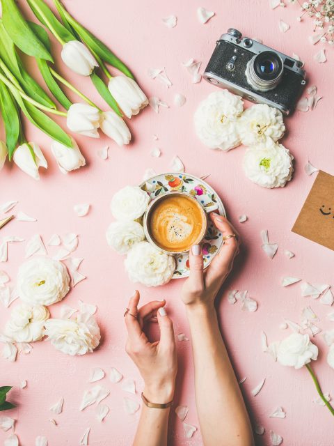 female-hands-holding-coffee-flowers-film-camera-2021-08-26-16-17-54-utc